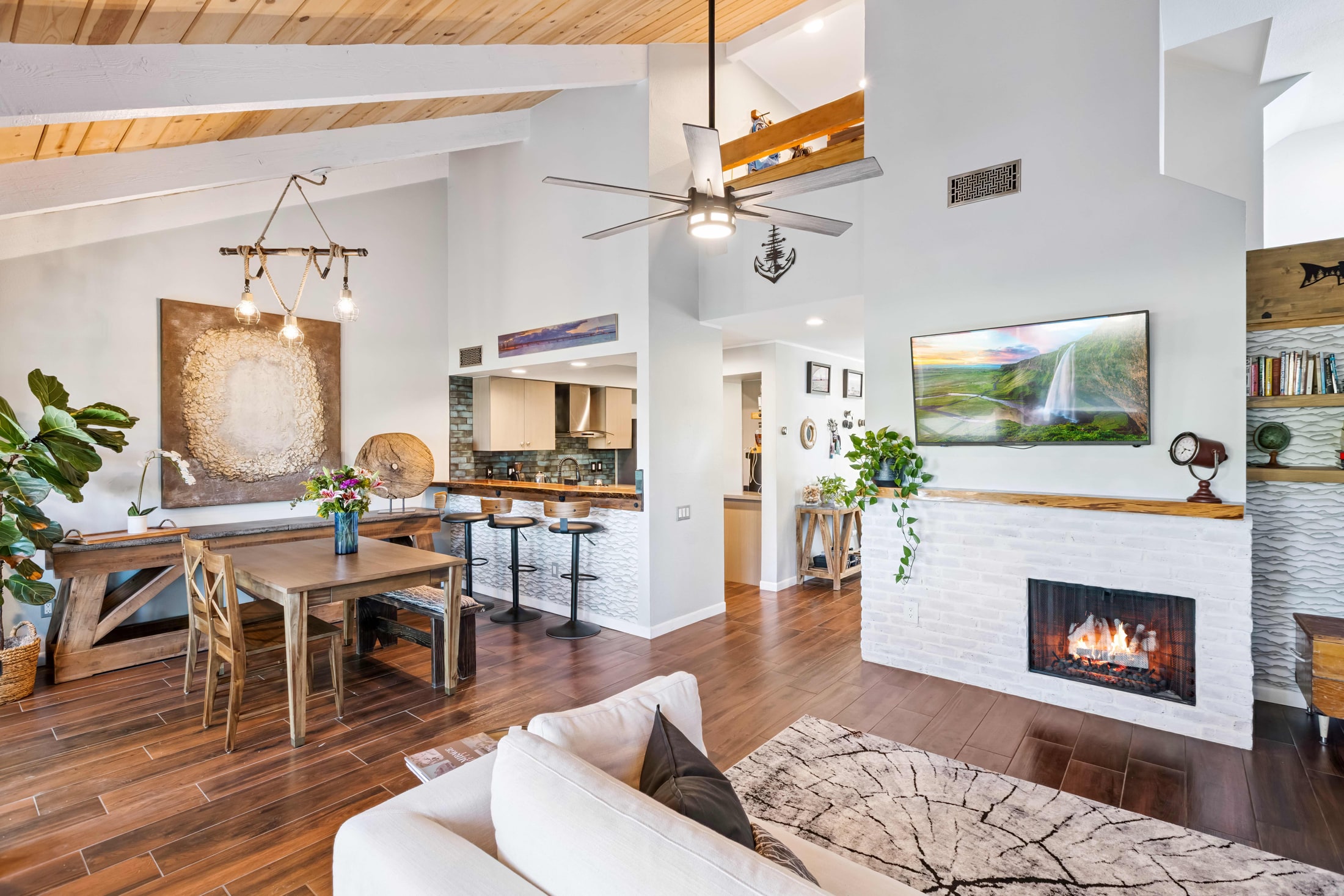Open-concept living and dining area prepared for listing photography