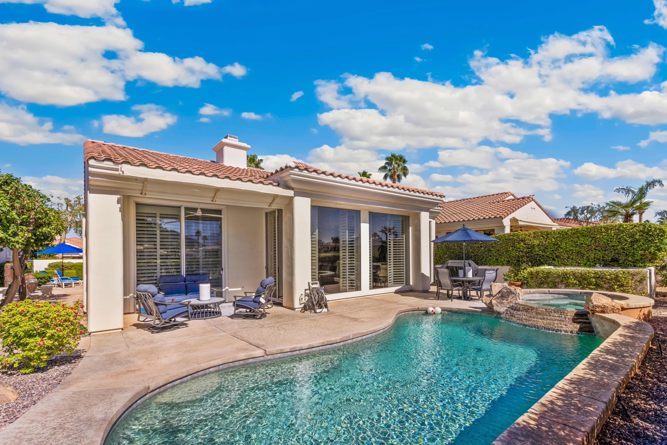 Backyard pool and patio at a Coachella Valley vacation rental